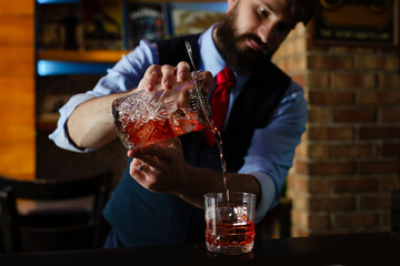 Bartender guy working prepare cocktail skills