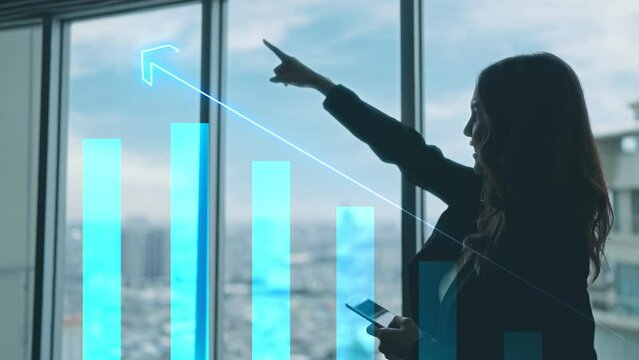 Asian business woman discussing business growth and show graph data To demonstrate the company's growth at the office