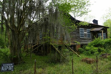 Abandoned wooden house at Old Cahawba, Alabama surrounded by greenery