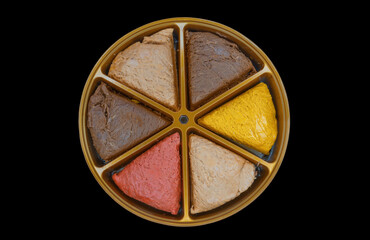 Different type and variety of halva in triangle dishes close-up. Juicy and sweet halva in detail. Soft selective focus