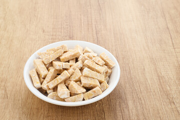 Raw Tempeh, Tempeh or Tempe, Indonesian traditional food, made from fermented soybeans. Usually fried for a side dish or for other cooking ingredients.

