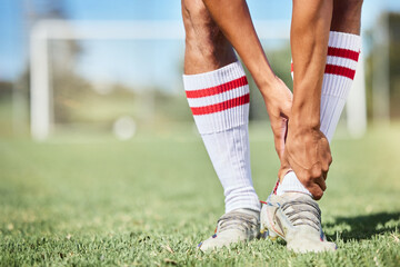 Soccer, sports and ankle pain, injury or accident on a field during a game, exercise or training. Muscle sprain, broken joint or medical emergency of a man athlete at a football pitch during a match. - obrazy, fototapety, plakaty