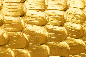 Abstract golden scales close up texture