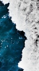 Vertical closeup of sea foam poster, blue waves with a long exposure effect