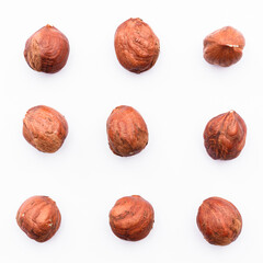 Hazelnuts isolated on white background. Composition of nuts pattern. Top view. Flatlay