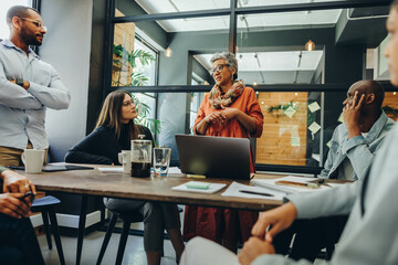 Creative entrepreneurs having a meeting in a modern workplace