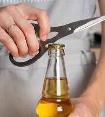opener as a function on scissors to open a bottle of beverage