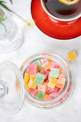 Turkish Delight. view of the tol with a cup of tea and Turkish delight sweets on a plate. A traditional oriental treat is sweetness.