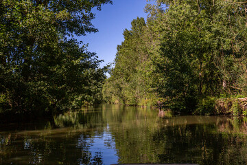 Fototapeta na wymiar Boat trip on an inner canal in the Marais Poitevin