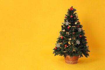 Concept of Happy New Year, Christmas tree on yellow background