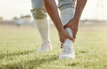 Sports, field and man with ankle injury after game, competition or baseball performance workout. Emergency, training accident or athlete legs in pain after fitness, exercise or running on grass pitch