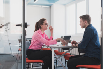 Emotional couple of young colleagues arguing in modern office. African-american business woman shouting at her sad man assistant, copy space, side view