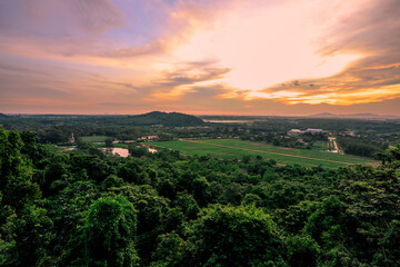 The background of the sea by the evening sea, with natural beauty (sea water, rocks, sky) and fishermen are fishing by the river bank, is a pleasure during travel.