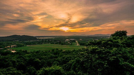 The background of the sea by the evening sea, with natural beauty (sea water, rocks, sky) and fishermen are fishing by the river bank, is a pleasure during travel.