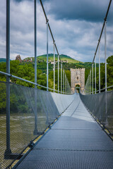 The old suspenson bridge over the Rhone River in Rochemaure, in the South of France (Ardeche)