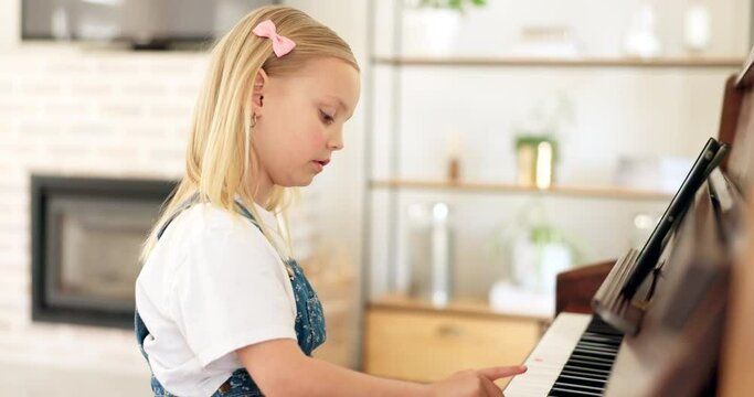 Piano, girl and music class, learning and development, creative student and focus, practice and play in the home. Young child, learn and concentrate, artistic and musical instrument education.