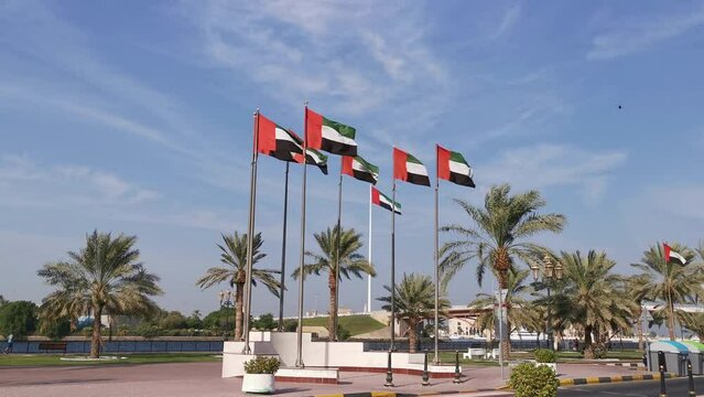 United Arab Emirates flags waving in the wind. National day of UAE, flag day