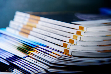 close up of a stack of books on a table