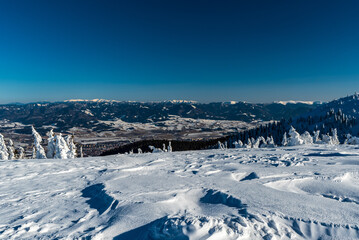 Fototapeta na wymiar Velka Fatra and low Tatras from Zazriva hill in winter Mala Fatra mountains in Slovakia