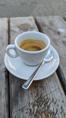 cup of coffee on wood table