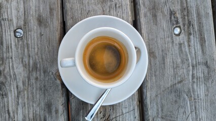 cup of coffee on wooden table