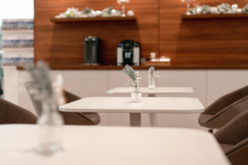 Christmas decoration in a cafe. New Year's composition in the restaurant. Silver Christmas toys and tinsel. Festive mood in the workplace. No people