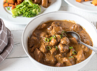 Braised chicken breast with low fat milk sauce. Healthy eating meal