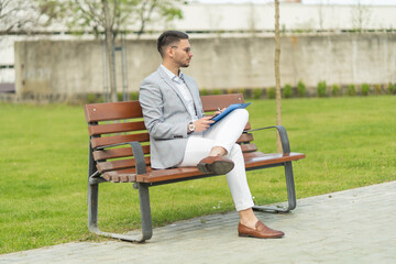 Fototapeta premium Sitting on the bench while working