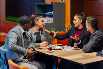 Laughing together while talking about the business plans