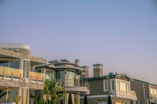 La Jolla, California- Row of beach houses with sunset glow on reflective glass panes