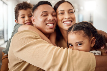 Love, family and hug portrait in living room with Mexican parents and young kids in house. Care and happy latino man, woman and children enjoy cuddle together for care and affection in home