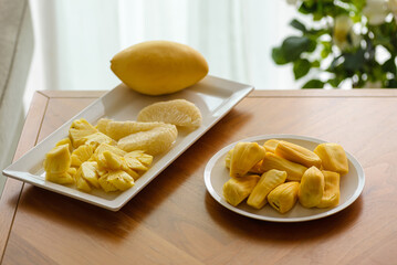 pineapple pomelo and jackfruit on a white plate