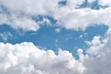 White clouds with blue sky in a sunny day. Sky in the morning. Concept of new life beginning, freedom of life and peaceful.	
