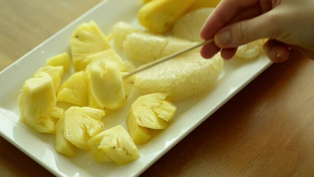 pineapple pomelo and jackfruit on a white plate