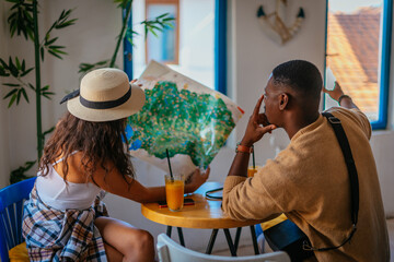 Two friends talking about visiting the next city