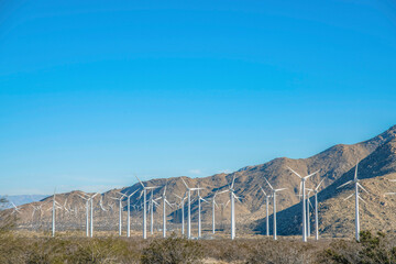 Palm Springs, California- Windmills on a shrubland near the mountain