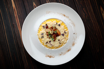 Porridge with butter and mushrooms on a plate