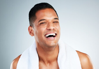Happy, laugh and face of man clean after wellness wash, facial cleaning routine and skincare...