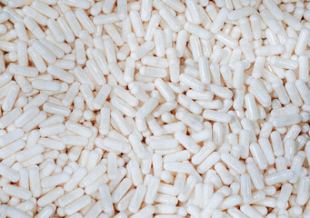 stack of capsule pill background, top view.                          