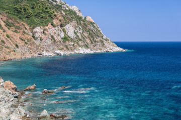 Hidden from prying eyes, cozy little lagoon on south coast of Sithonia peninsula with crystal clear transparent turquoise water of Aegean Sea,Toroni, Chalkidiki, Greece