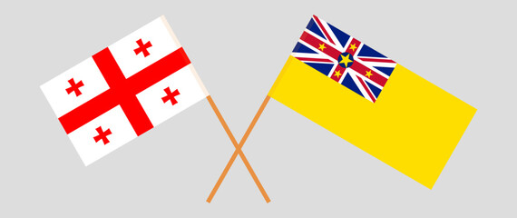 Obraz premium Crossed flags of Georgia and Niue. Official colors. Correct proportion