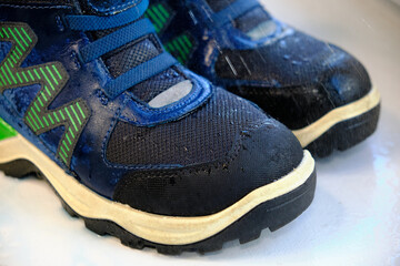 close-up details waterproof Children's Shoes. Drops of rain on suede shoes.