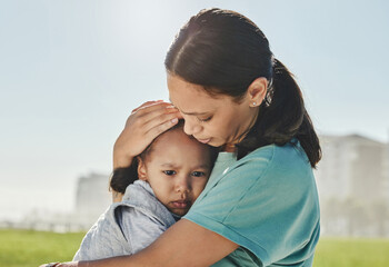 Woman, child and sad with comfort, love and care in hug, embrace and holding outdoor at park. Mom,...