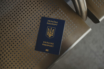 Ukrainian passport above a seat. Travel abroad concept. High quality photo