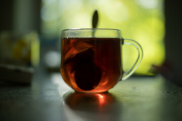 Tea on table in morning. Glass of tea. Drink for breakfast.