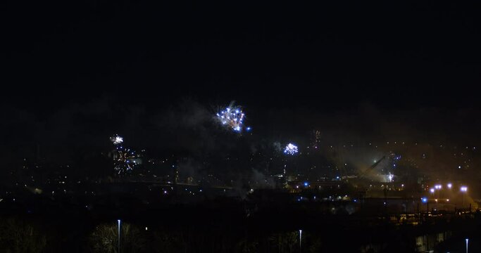 happy new year's eve fireworks over the city panoramic view | 4k 12-bit footage