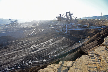 A huge bucket-wheel excavator digging coal on the open-pit mine.