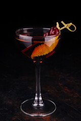 Glass of tasty Negroni cocktail with orange peel