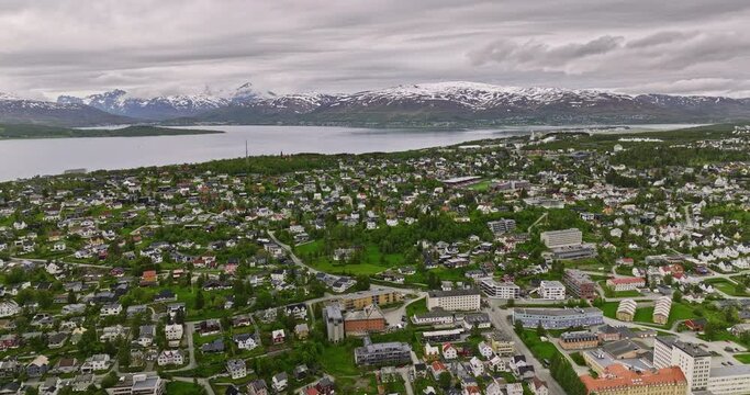 Troms&oslash; Norway Aerial v5 drone flyover downtown across residential neighborhoods of elverh&oslash;y, stalheim and forh&aring;pningen overlooking at mountainous landscape - Shot with Mavic 3 Cine - June 2022