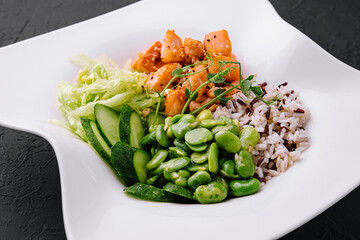Hawaiian salmon poke salad with rice closeup